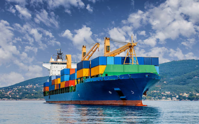 Cargo ship transporting containers across the sea for global trade and air cargo logistics management services